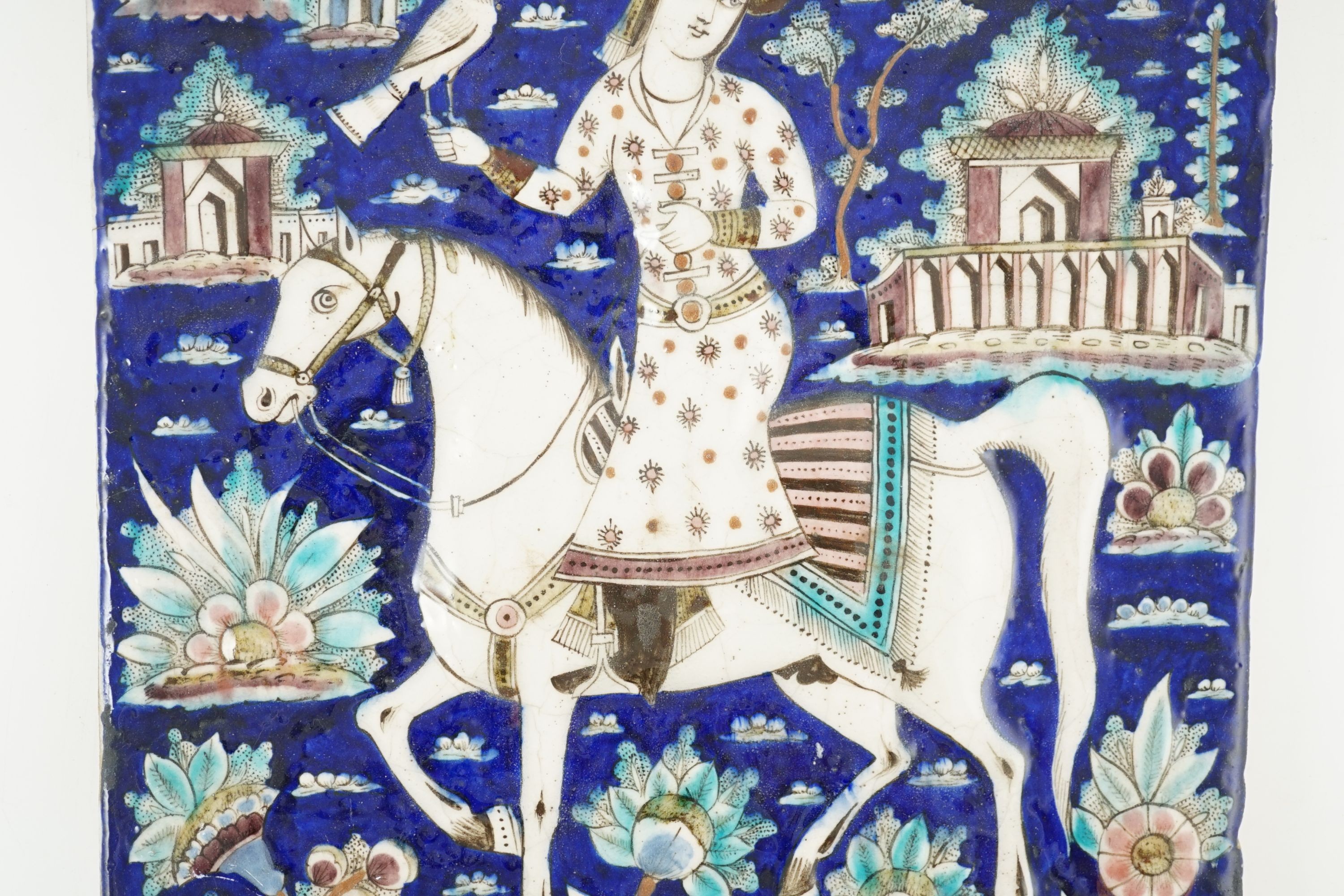 A Persian polychrome tile, Qajar dynasty - 34.5 x 27cm 34 cm x 27.5 cm